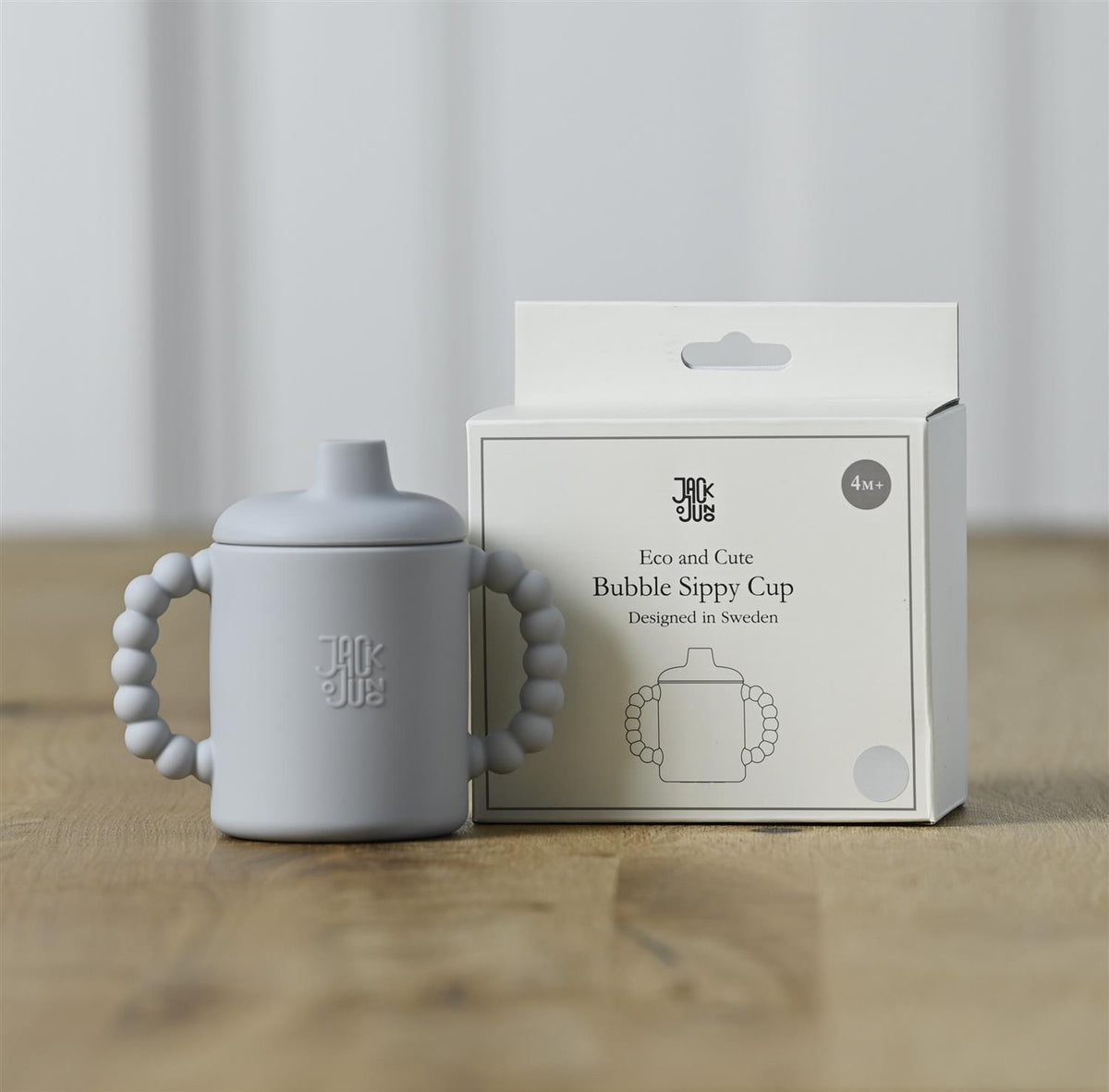 JACK o JUNO Bubble Sippy Cup i grå, barneservise med fargeglad design, laget av trygt materiale for små barn.
